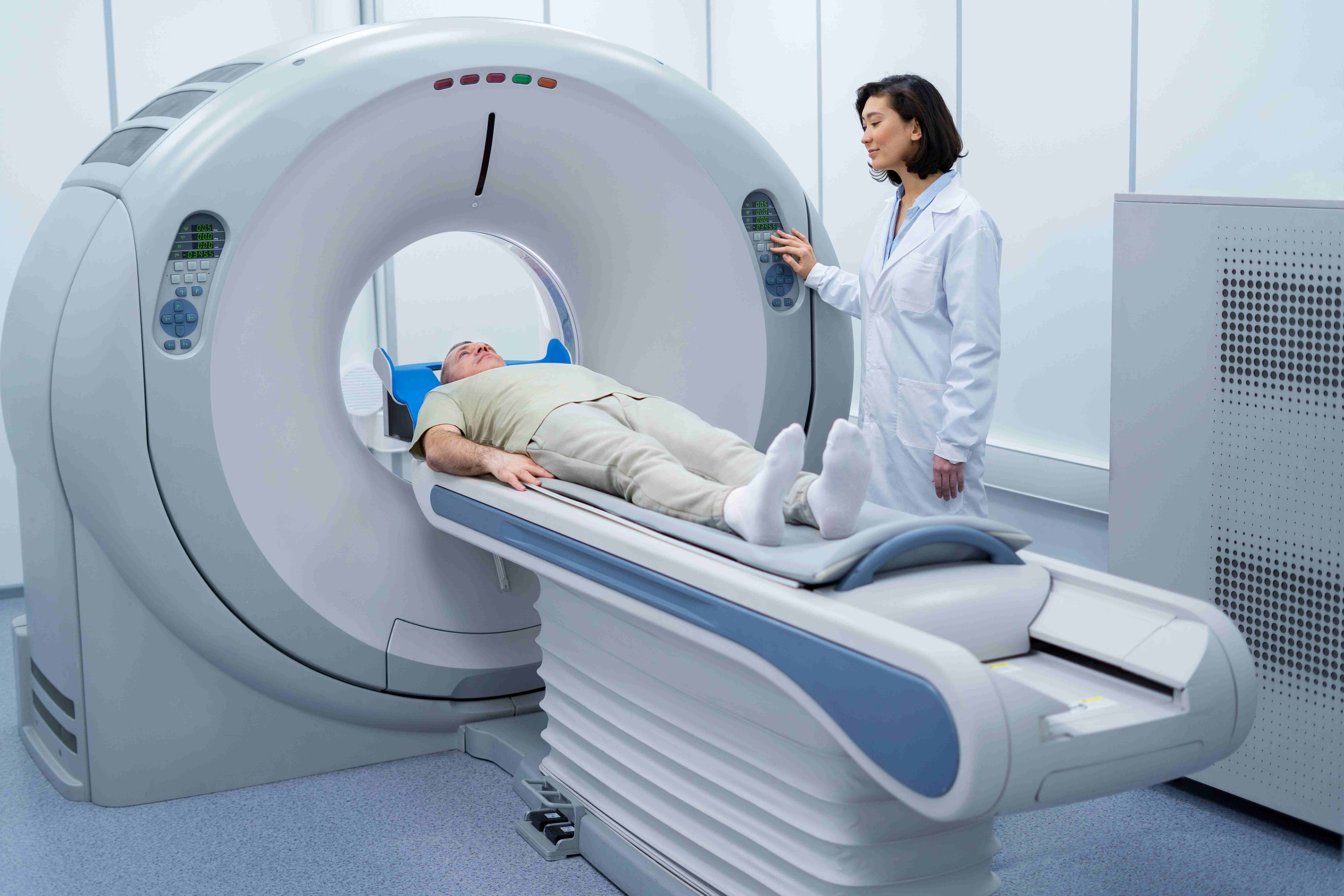 doctor-getting-patient-ready-ct-scan-compressed